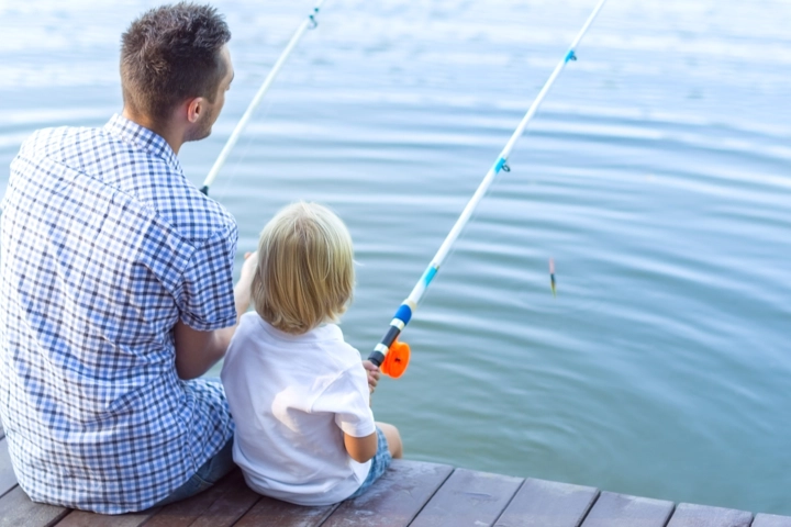 Father and son fishing on a dock - aquatic care by Sorko Services in Central Florida