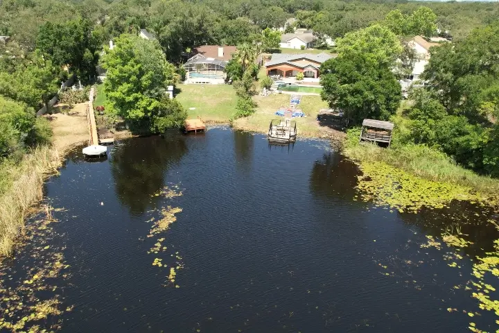 Residential lake clearing by Sorko Services in Central Florida